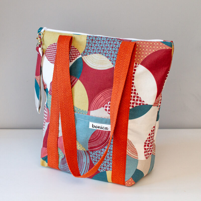 Bolso totebag con cremallera en colores rojos